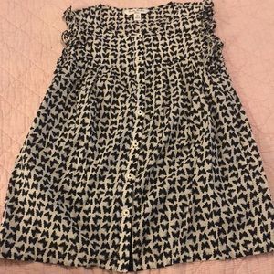 Brock’s Brothers sleeveless ruffle butterfly top